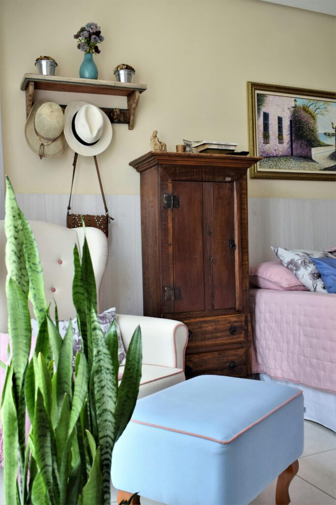 Stylish bedroom featuring vintage wooden furniture and cozy decor.